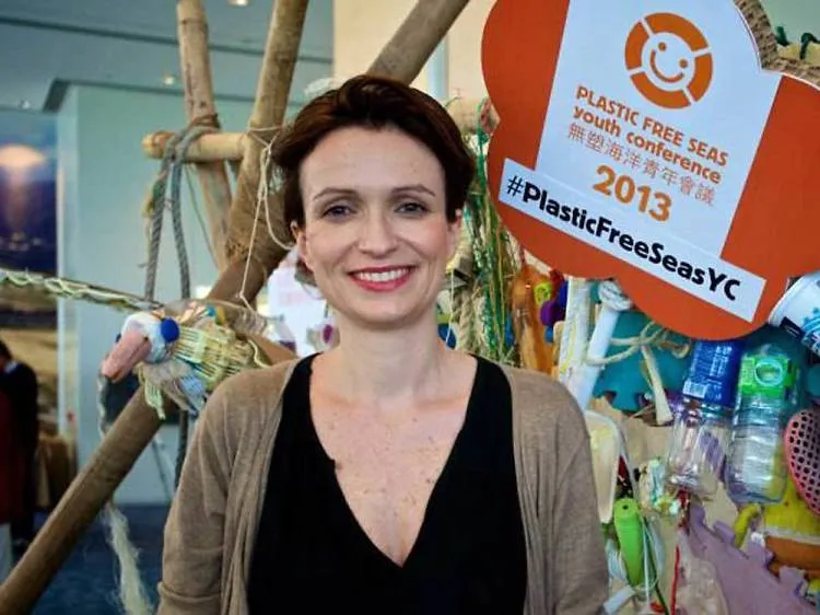 Claire at the Plastic Free Seas Youth Conference 2013 in Hong Kong, beside an installation of collected plastic